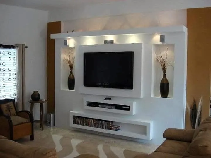 white living room television wall with display niches and concealed media storage