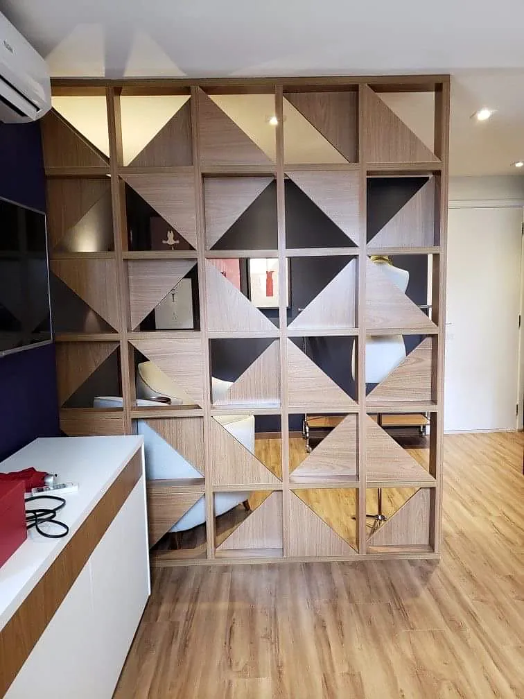 timber geometric room divider with open display compartments